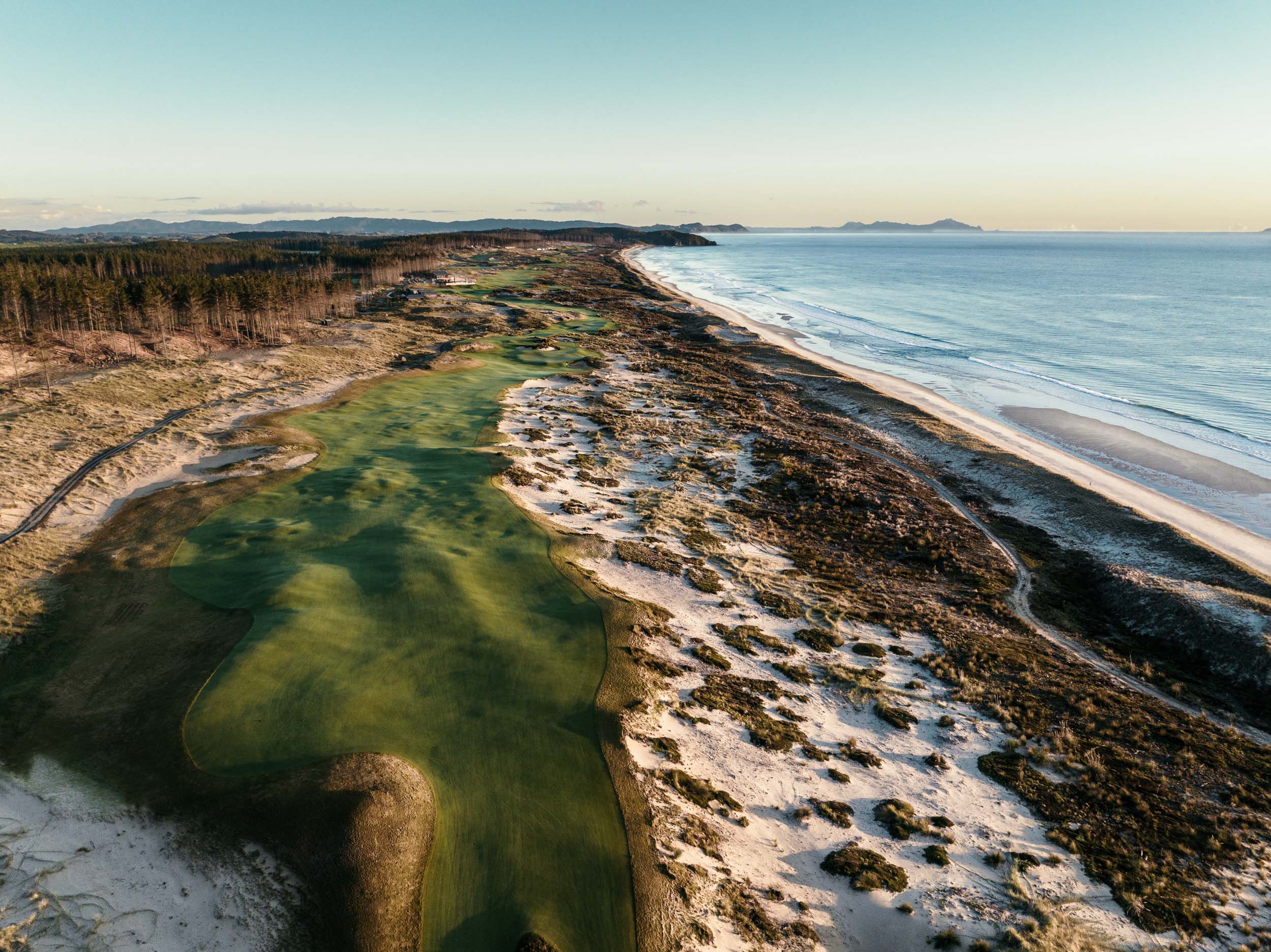 Te Arai Links from the air, fairways between the dunes and the long Pacific beach